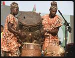 Performing Artists Carry a Drum to the Stage [photo credit: https://www.vanguardngr.com]